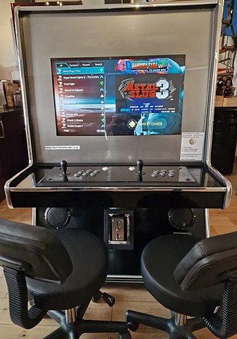Sit-down cabinet with two stools at the control deck