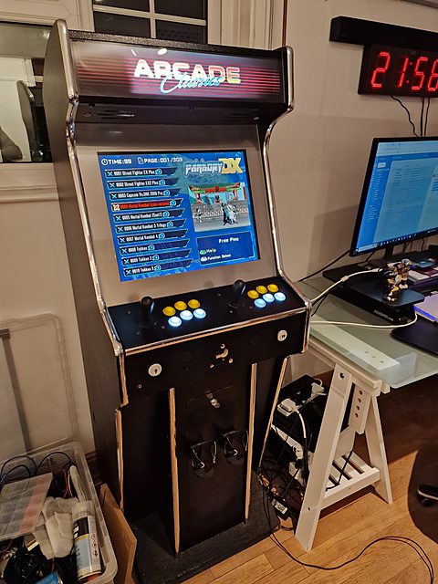 Stand-up cabinet in a home games room with the game menu on screen